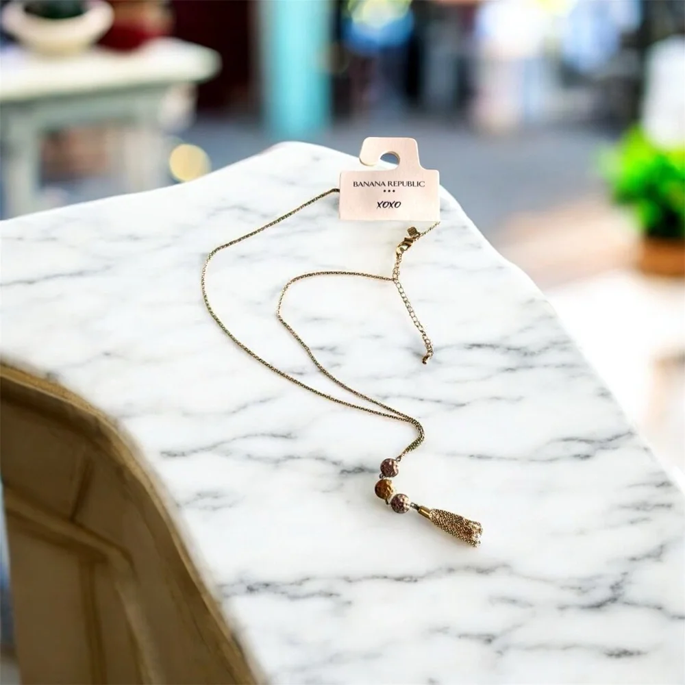 Banana Republic Gold and Silver Tassels Pendant Necklace. New with tags .